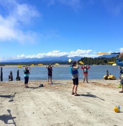 practicing kayaking at okarito lagoon new zealand