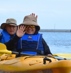 kayakers at okarito lagoon new zealand