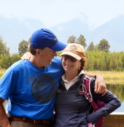 hikers at lake matheson new zealand