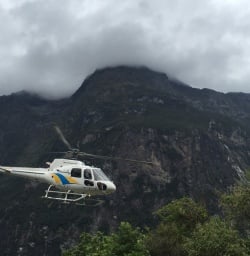 Helicopter arriving in Martins Bay