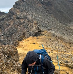Man hiking Tongariro National Park 200125
