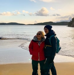 4. Guests on beach sunset Stewart Island