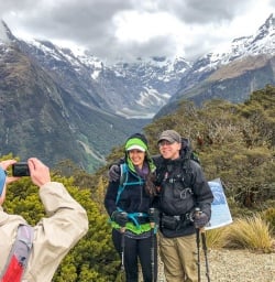 Couple at Key Summit Lookout Trail Lake, Fiordland New Zealand
