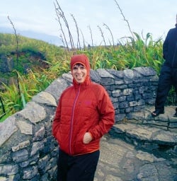 Hiker at Punakaiki pancake rocks