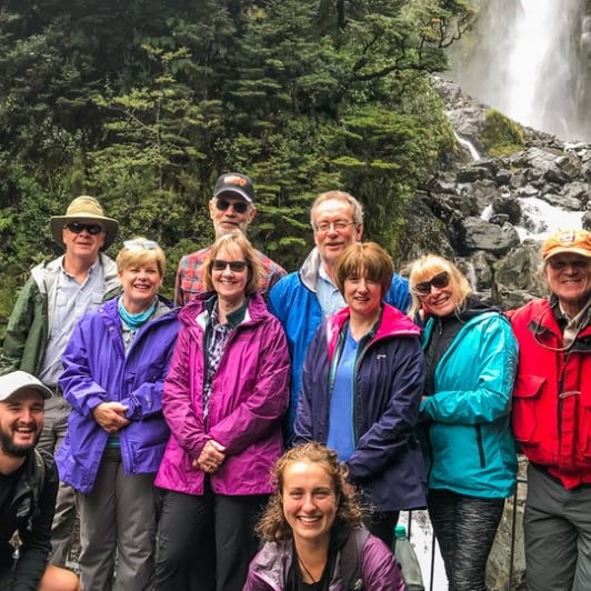 Group at Devils Punchbowl Waterfall, Arthurs Pass National Park, Canterbury New Zealand