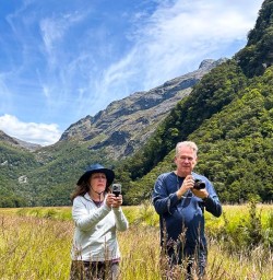 couple taking photos on the Routeburn Track