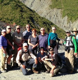 hikers at fox glacier new zealand