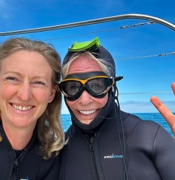 guests and guide Holly swimming with dolphins GE26JAN26