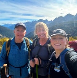 guests and guide Toni explore Fiordland National park RM09MAr26