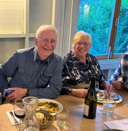 guests enjoying dinner together GE10NOV25
