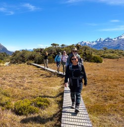 guests hike Routeburn track Fiordland national park KC24NOV25