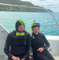guests in Kaikoura swimming with dolphins KC23FEB26