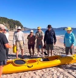 guests kayak Cathedral Cove RS03MAR26