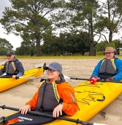 guests kayaking Cathedral Cove SN10MAR26