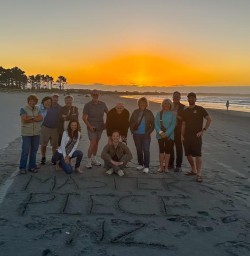 guests on beach west coast sunset RM26JAN26
