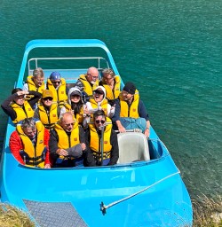 guests on jet boat in mt aspiring national park PS09FEB26