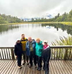 guests visit Lake Matheson RM09MAR26
