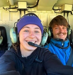 guides Chloe and Cullen on heli flight with our guests into Siberia Valley GE09MAR26
