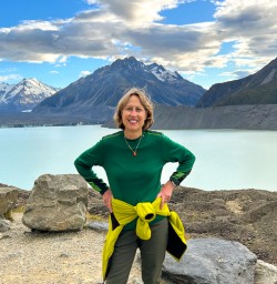 happy guest in mt cook national park glacier lake PS23FEB26