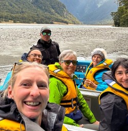 happy guests and guide Holly on Jet boat tour in mt Aspiring National Park PS09MAR26