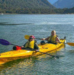 happy guests kayaking Milford Sound PS02MAR26