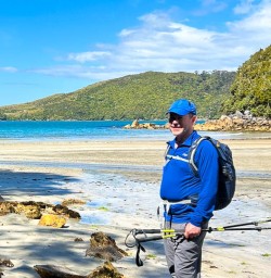 male guest enjoying the 4 male guest on the beach at the Rakiura Track
