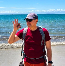 male guest on the beach at the Rakiura Track
