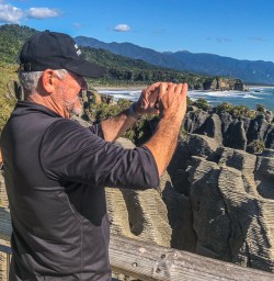 Taking pictures at Punakaiki Pancake Rocks and Blowholes, Porarari National Park West Coast New Zealand