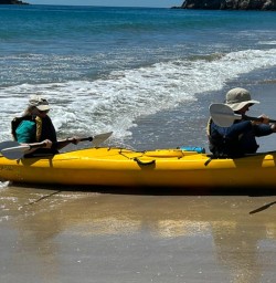 two guests kayaking Cathedral Cove SN04NOV25