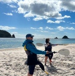 two guests kayaking Cathedral Cove SN28OCT25